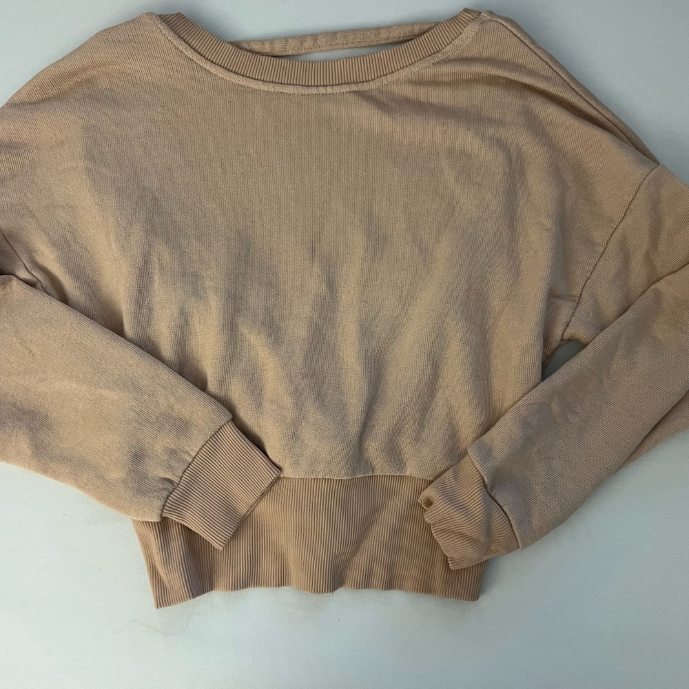 Don’t ask why open back pale pink sweatshirt